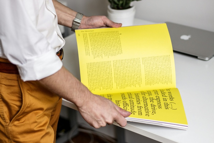 A printed magazine opened on a desk